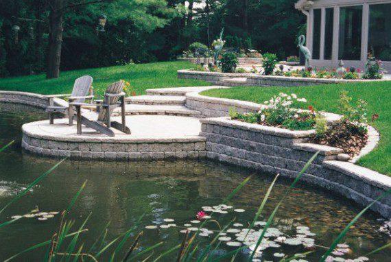 brick porch and wall by pond