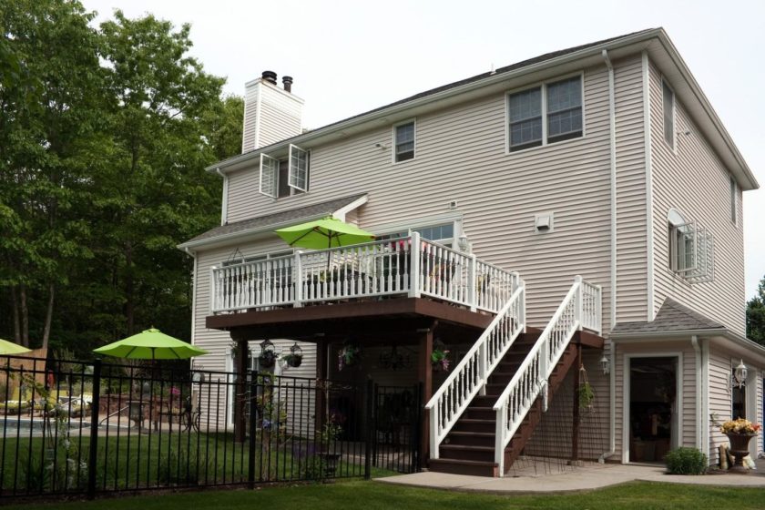 two story house with fence and railing