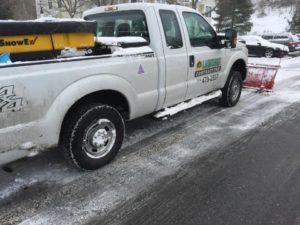 landwork-contractors-truck-snow-plowing