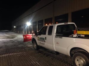 landwork-contractors-truck-snow-plowing-at-night