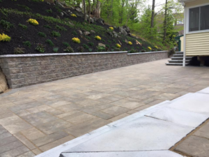 unilock retaining wall and stone patio install