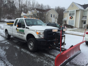 snow plowing LandworkContractors pickup truck