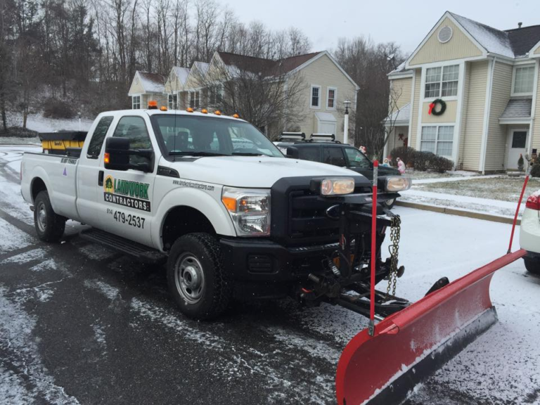 snow plowing LandworkContractors pickup truck - Landwork Contractors