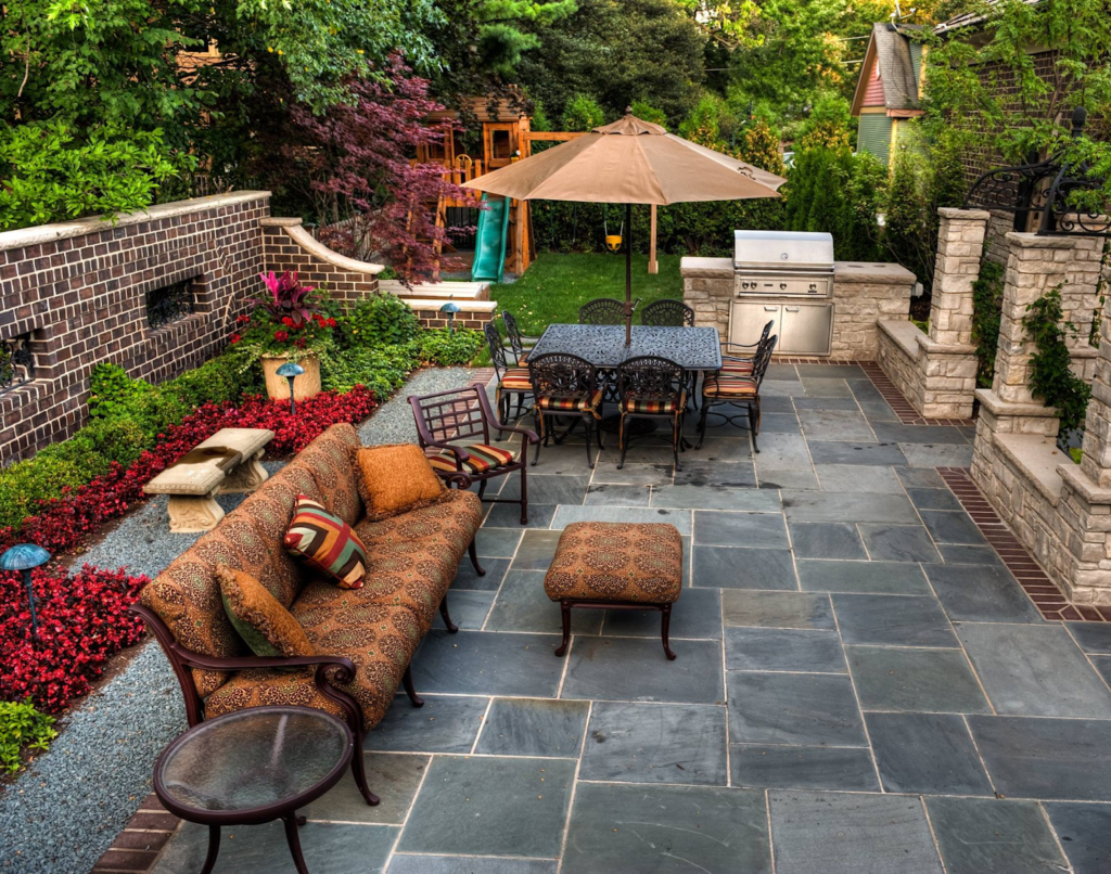 custom stone patio and outdoor kitchen