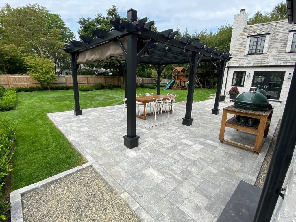 outdoor patio with gril and black gazebo