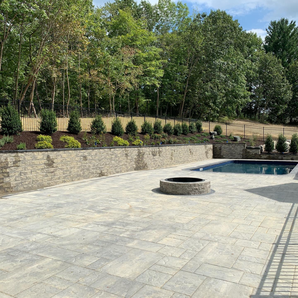 custom stone pool deck and jacuzzi