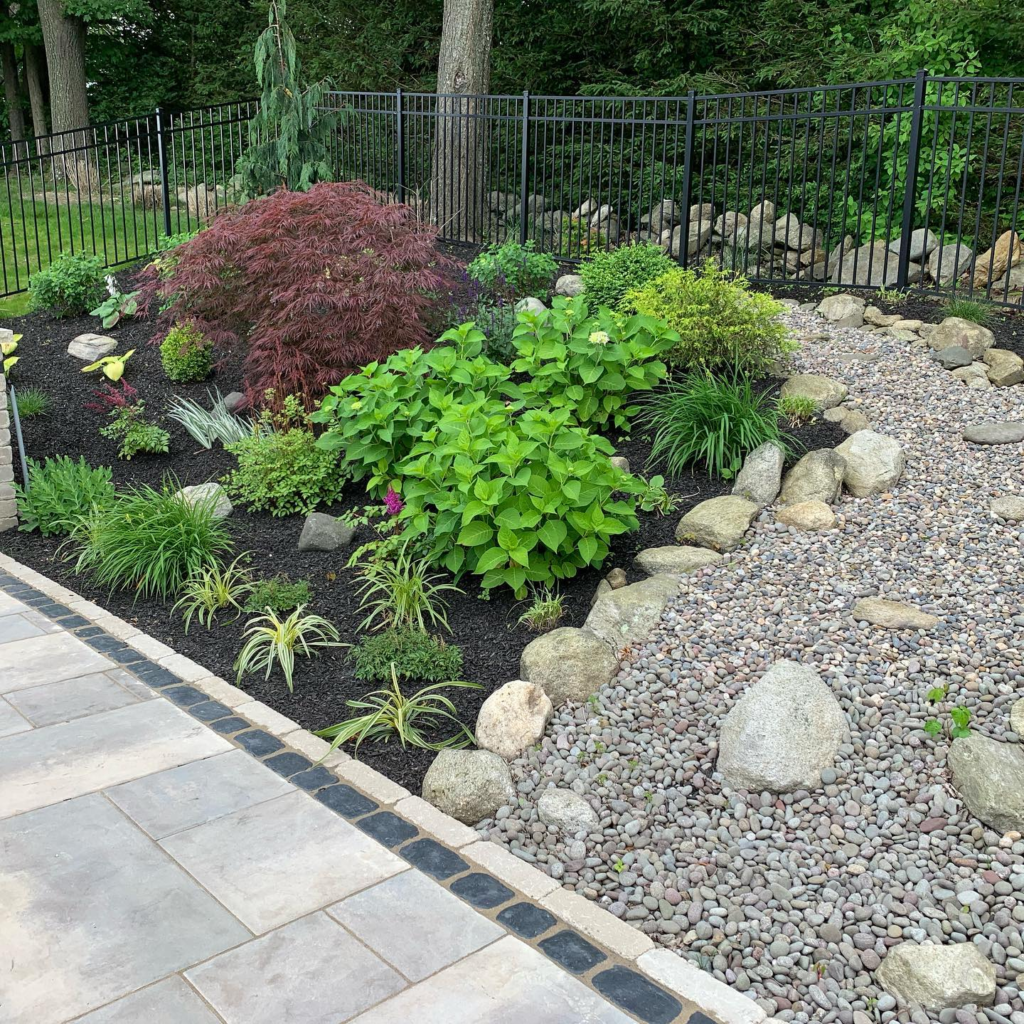 custom flower beds with rocks and mulch